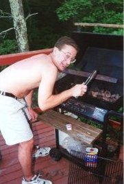 Chris cooking burgers.
