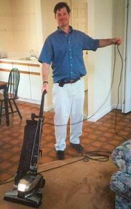 tom vacuuming